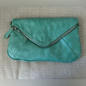 Turquoise Street Level Cluth with crossbody strap